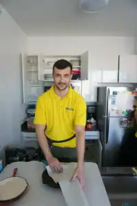 Lifestyle Moving & Storage team member standing in a kitchen