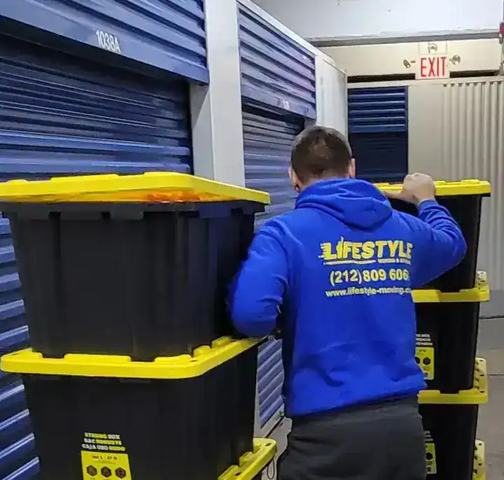 Mover beside stacked moving bins