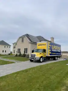 Lifestyle Moving & Storage truck outside a suburban home