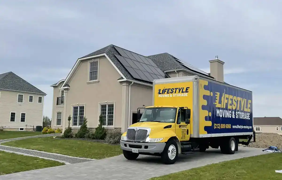 Lifestyle Moving & Storage truck parked outside a suburban home