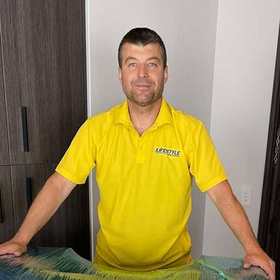 Lifestyle Moving & Storage team member standing indoors