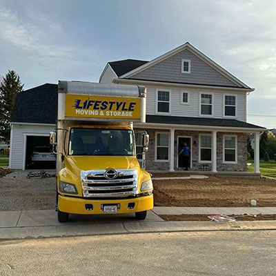 Lifestyle Moving & Storage truck outside a residential home