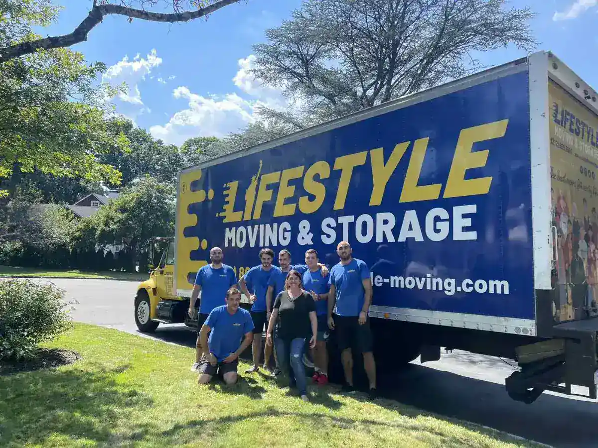 Lifestyle Moving & Storage crew posing beside a storage truck