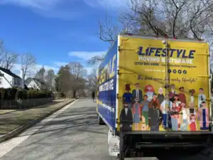 Lifestyle Moving & Storage truck parked outside a suburban home