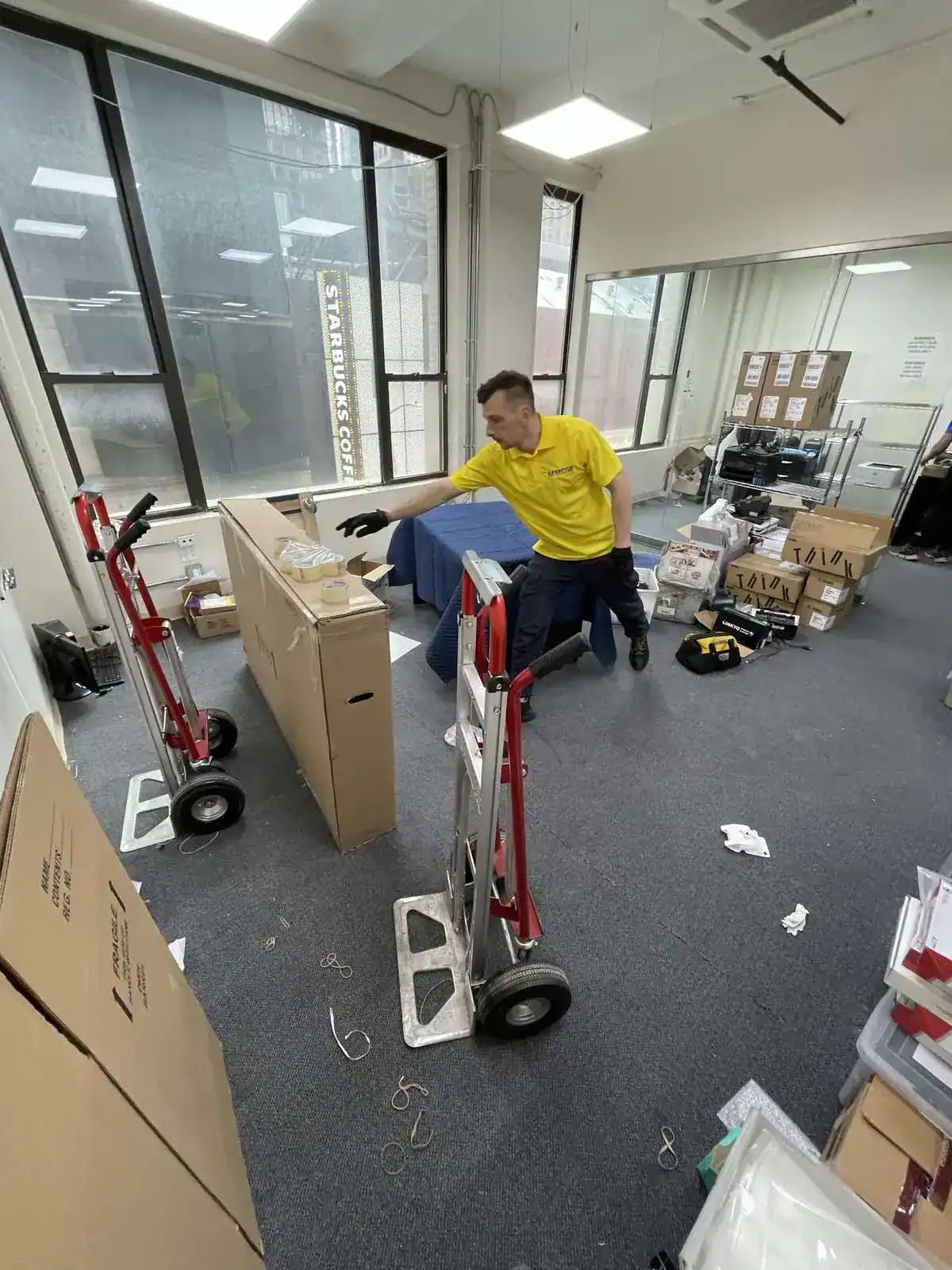 Movers packing furniture inside an apartment