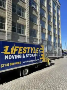 Lifestyle Moving & Storage truck beside a high-rise building